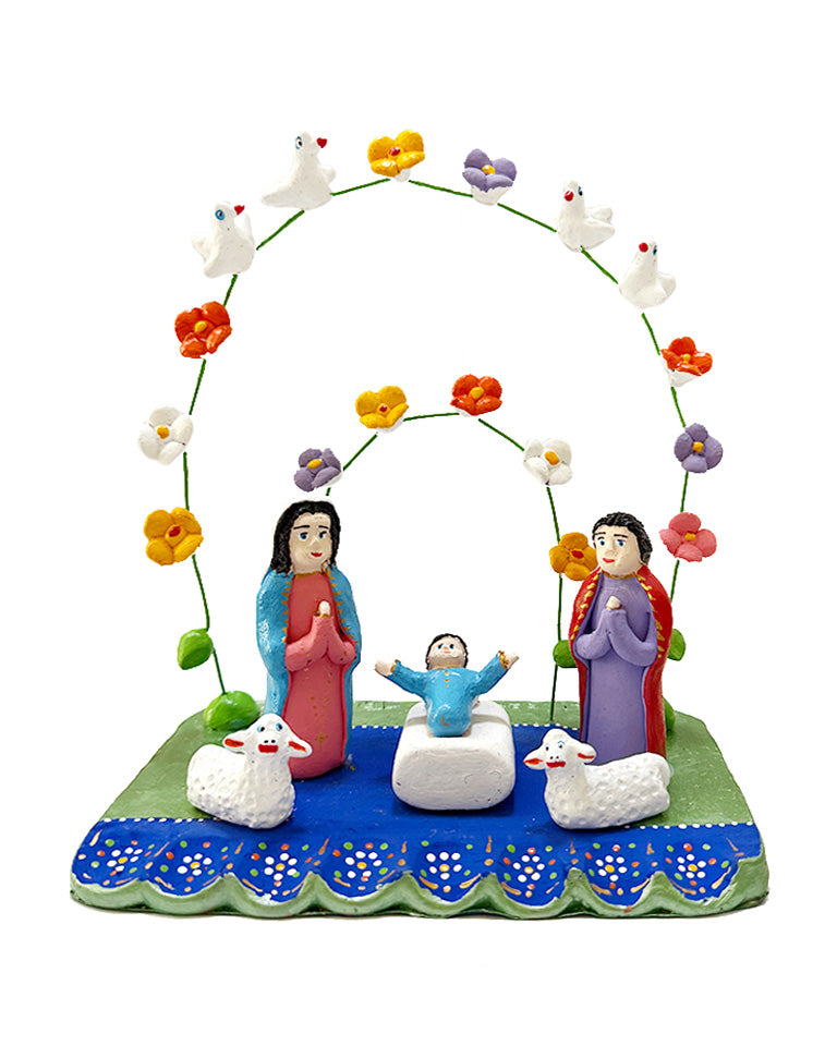 Presépio azul e verde com arcos (aves brancas e flores coloridas)